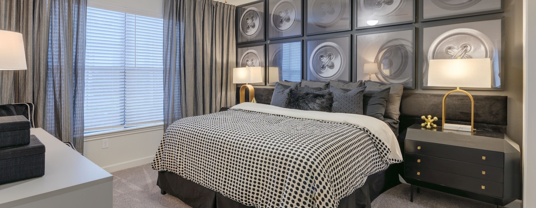 bedroom with nightstands and a large window