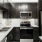 a kitchen with black cabinets