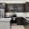 a kitchen with black cabinets