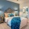 a bedroom with a bed and a fan