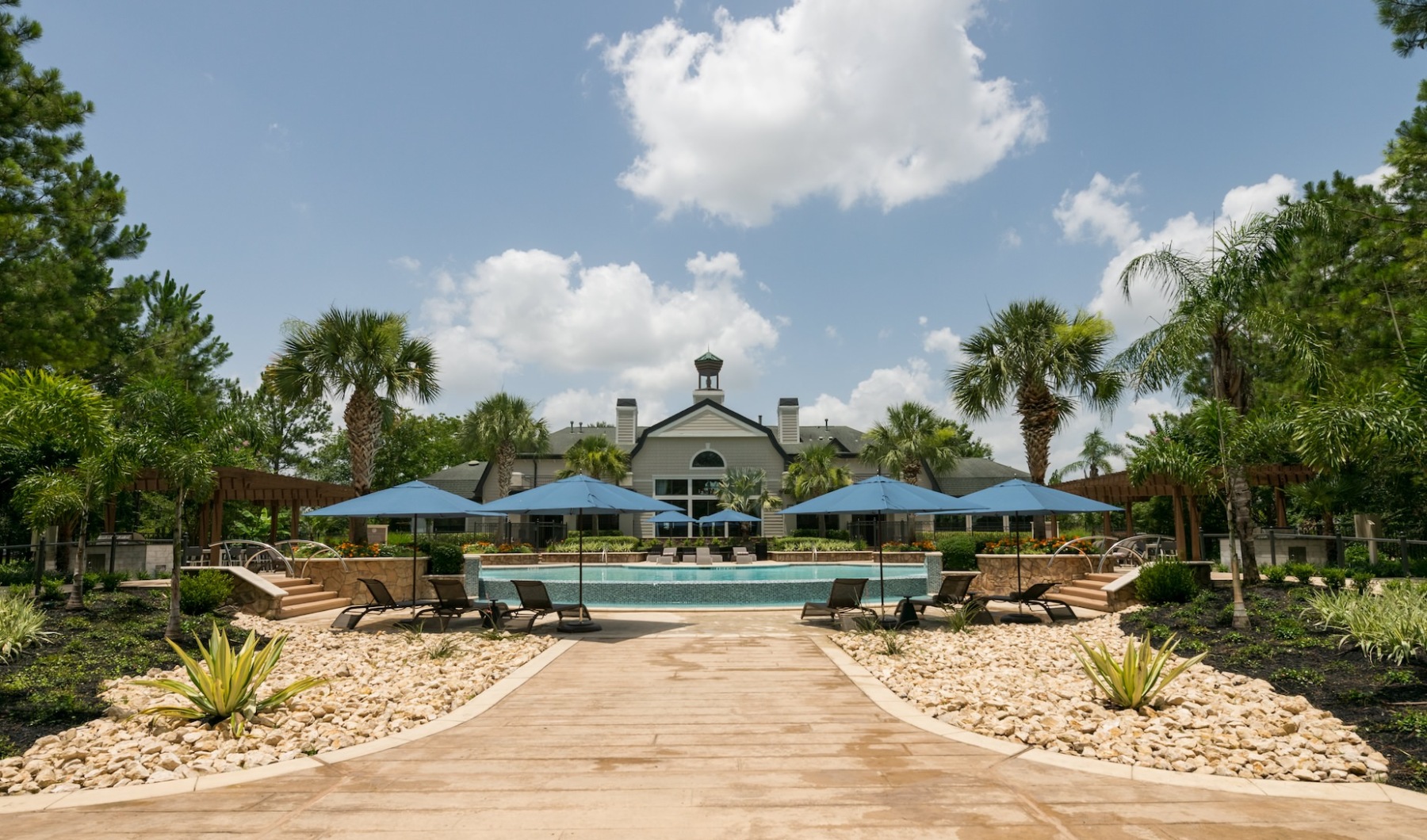 pool area with lush landscaping