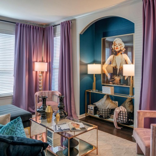 Beautiful living spaces with natural lighting a living room with a large mirror