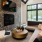 a living room with a large tv and a large window