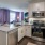 a kitchen with white cabinets