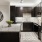 a kitchen with a table and a refrigerator