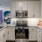 a kitchen with white cabinets