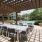 a patio with tables and chairs